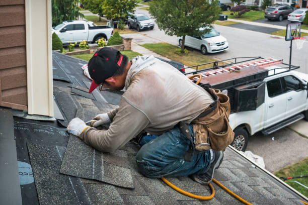 Professional Storm Damage Roof Repair technician working in Highlands, NJ